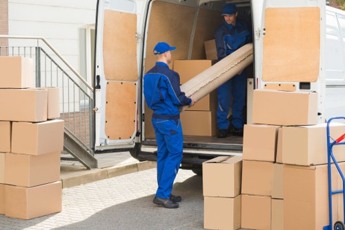 Moving van and packed boxes outside a Finchley home