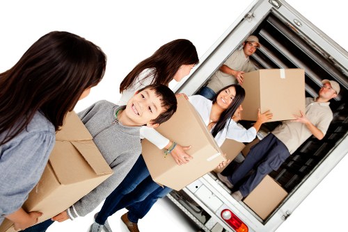 House movers loading furniture in a Finchley residential street