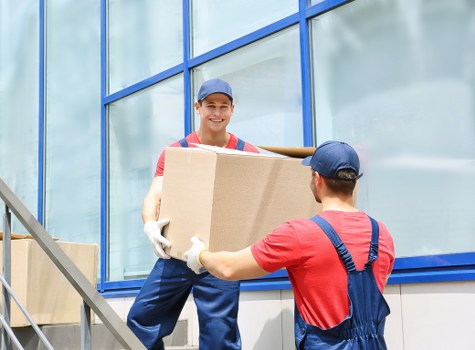 Removal team packing household items for a Finchley home move