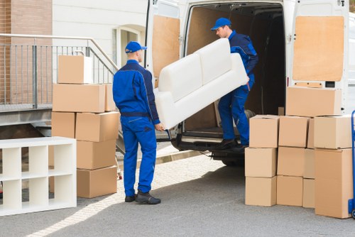 Packed boxes and furniture ready for collection by Finchley movers