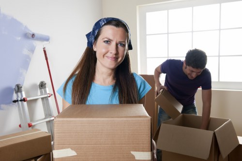 Professional movers loading boxes for a house removal in Finchley