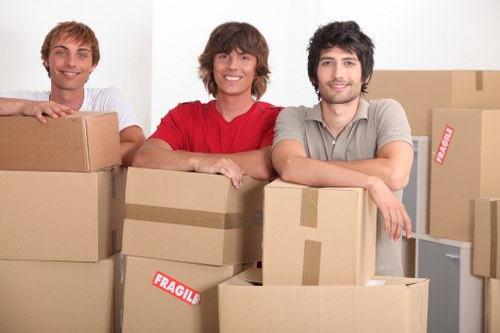 Moving equipment and wrapped furniture ready for transport in Finchley