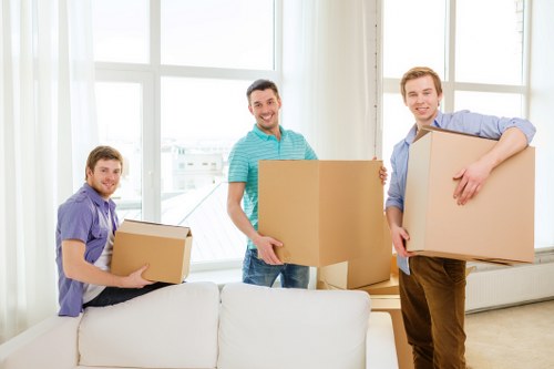 Loading household furniture into a removal van in Finchley