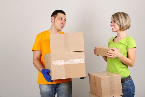 Careful wrapping of fragile household items during a Finchley move